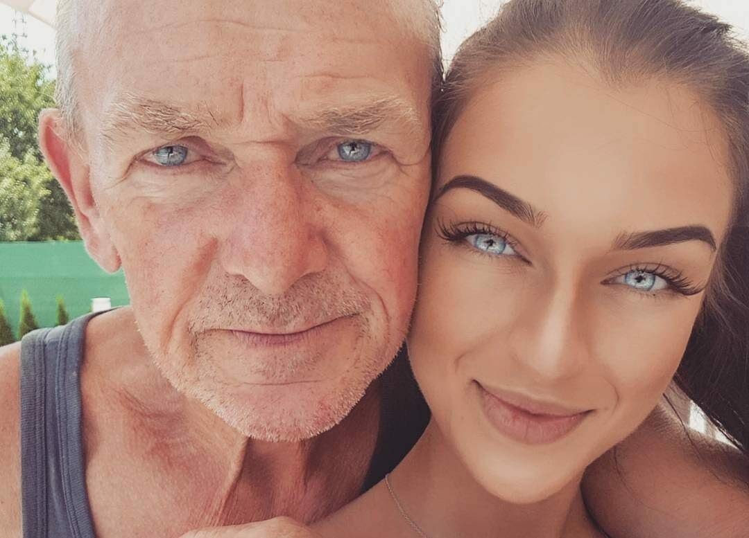 grandfather and granddaughter share a very similar tone of sky blue eyes