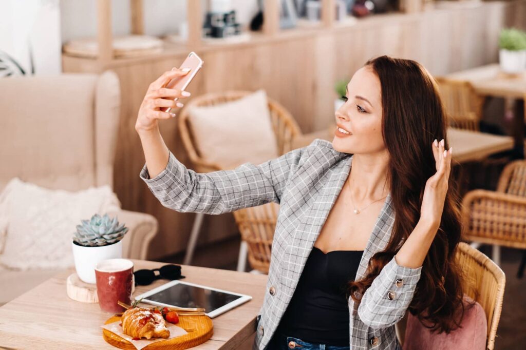 Pretty woman taking a selfie.