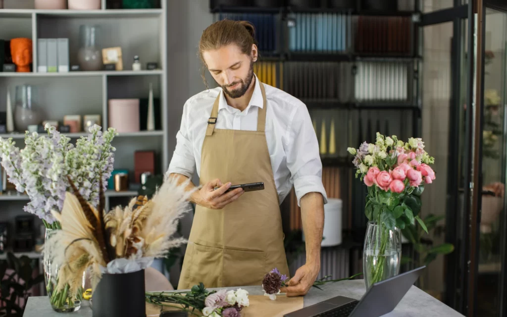 Florist using their phone to come up with Instagram story ideas