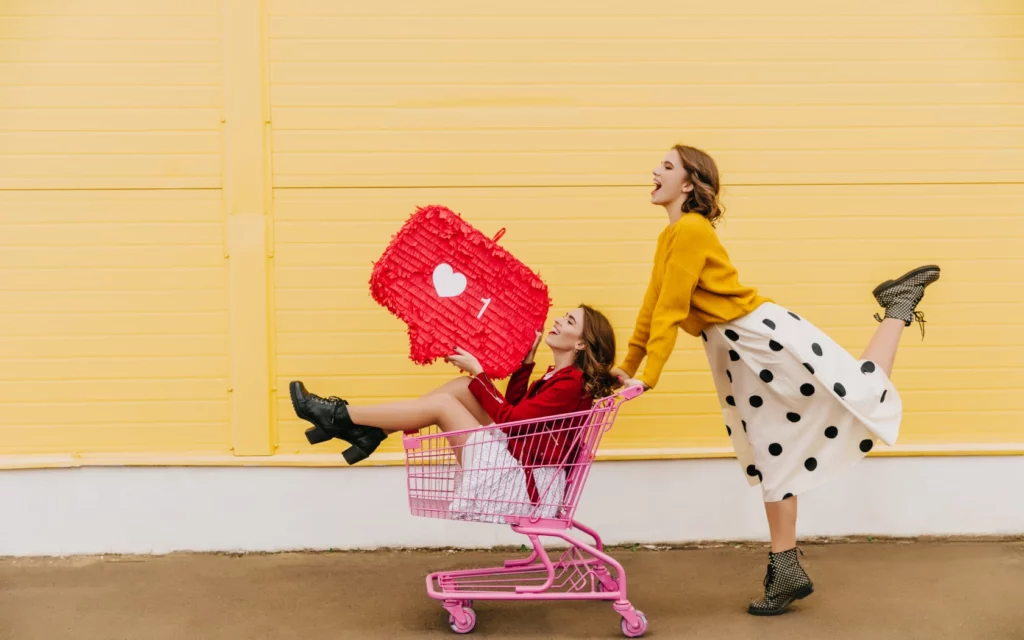 Two girls with social media icon and shopping cart