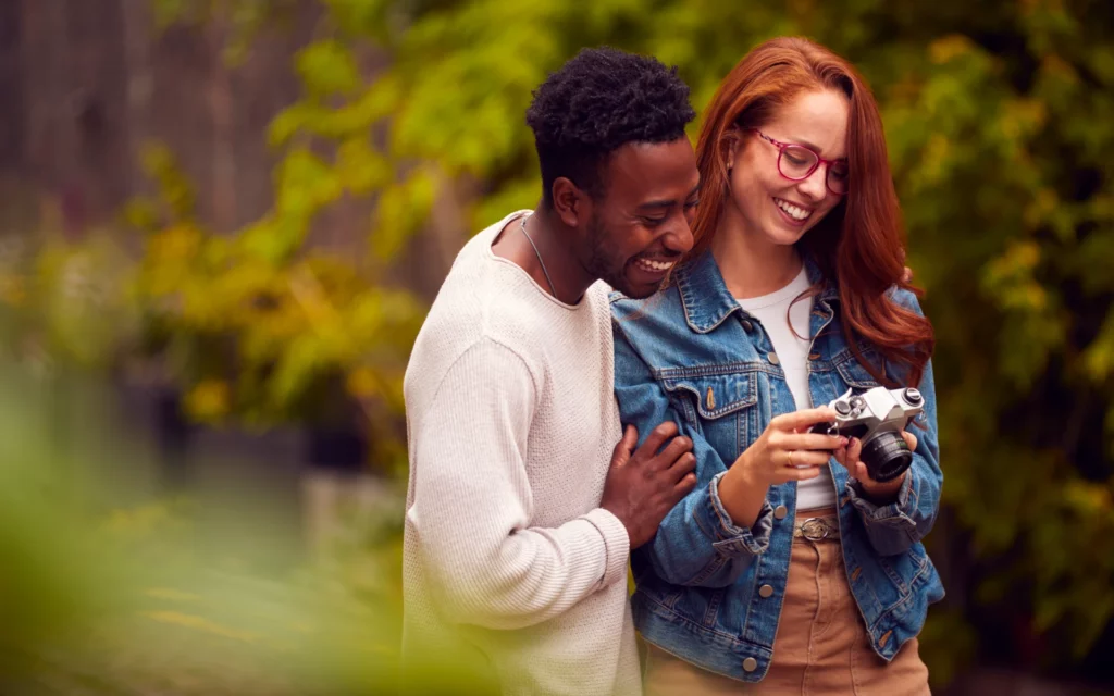 Influencers reviewing photos taken with retro Canon camera