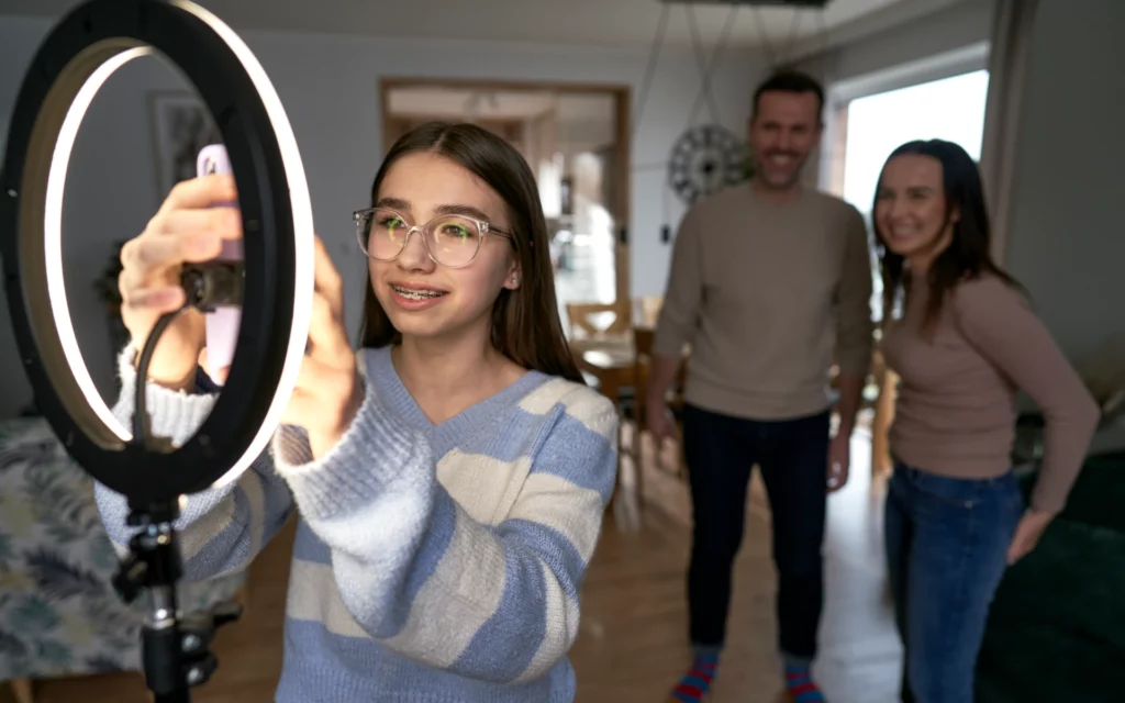 Teen making an Instagram Reel with her parents