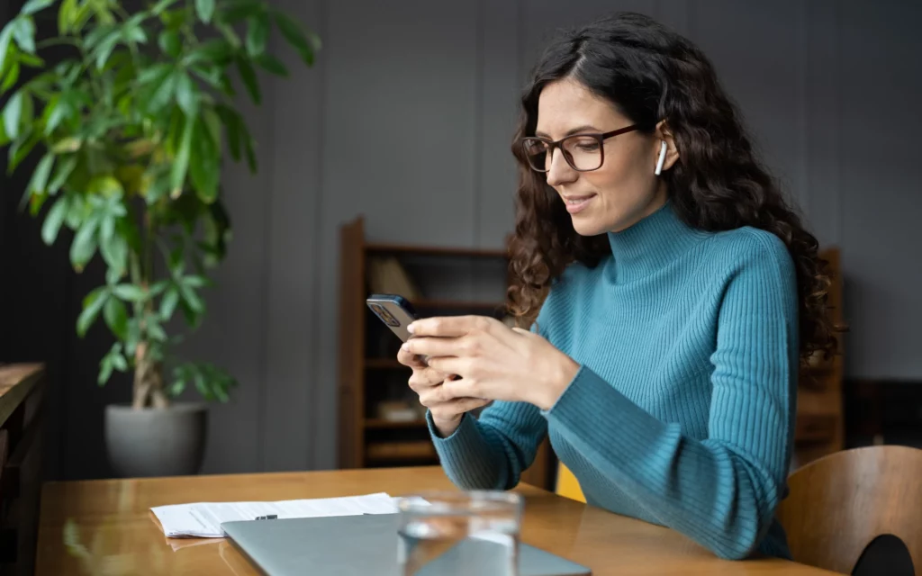 Business woman engaging with other social media accounts