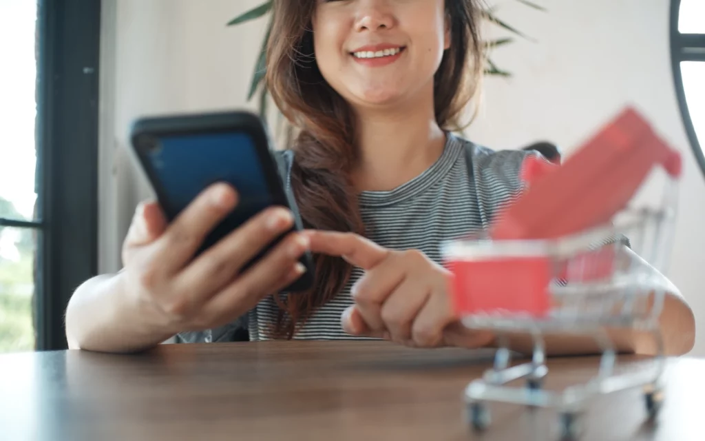 Female using smartphone to browse ecommerce site