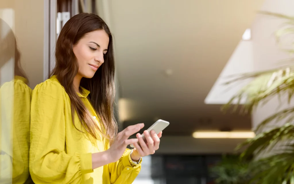 Young business woman using an Instagram follower count checker