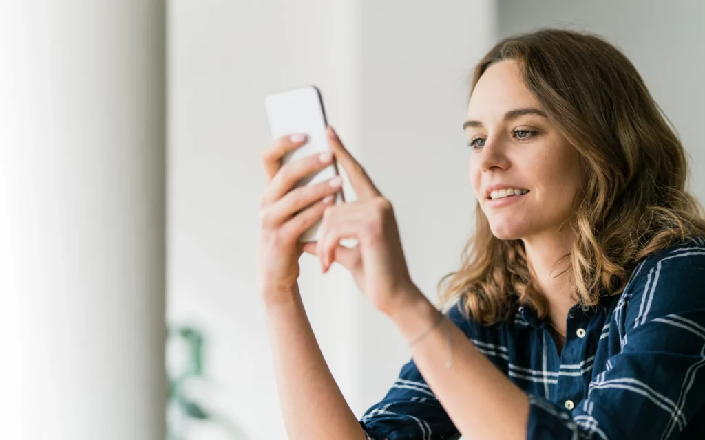 Woman typing in her Instagram username to see how many people follow her 