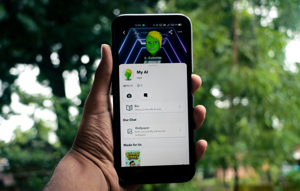 Man holding a phone with visible MY AI avatar.