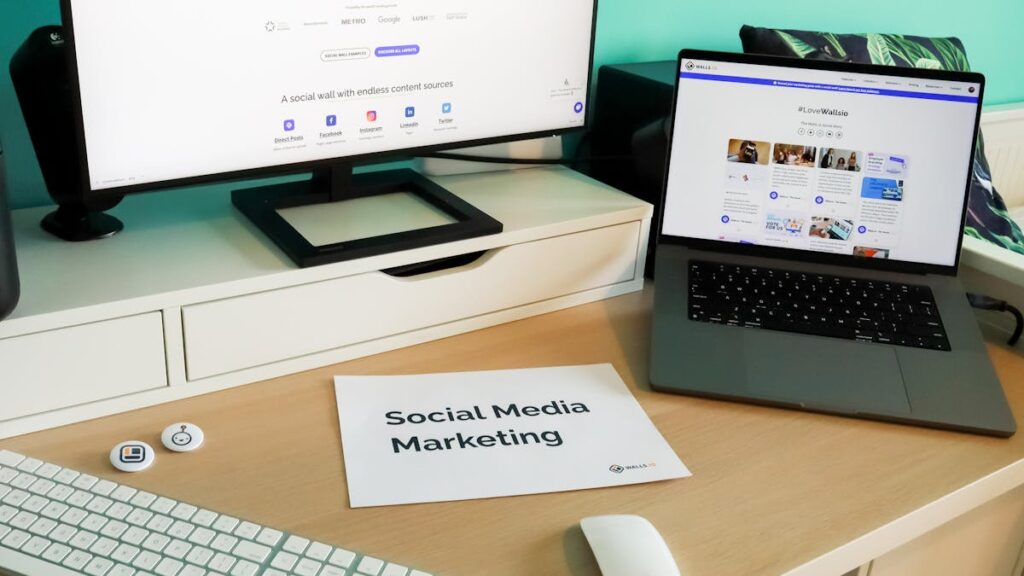 Stylish workspace with laptop and monitor for social media marketing.