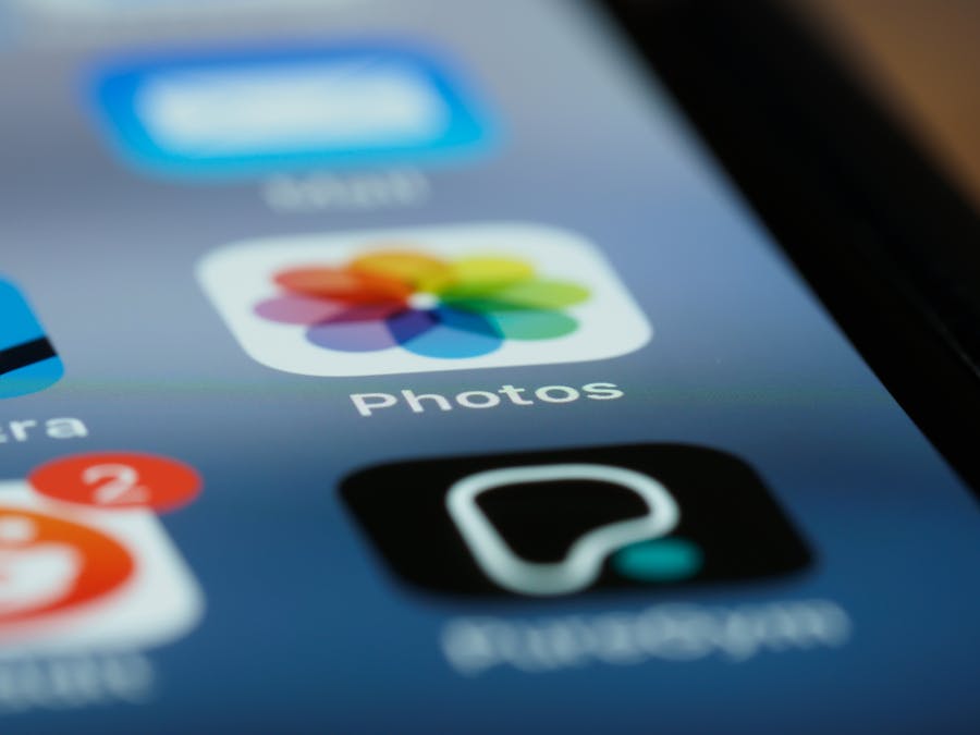 Detailed shot of smartphone screen showing app icons, including photos app.