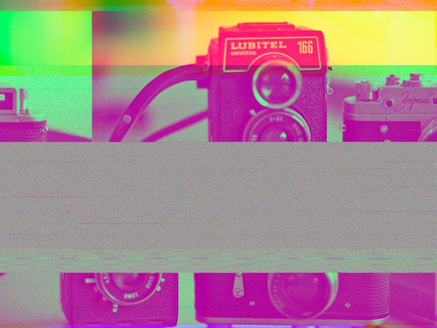Artistic display of vintage cameras featuring vibrant glitch effect and retro feel.