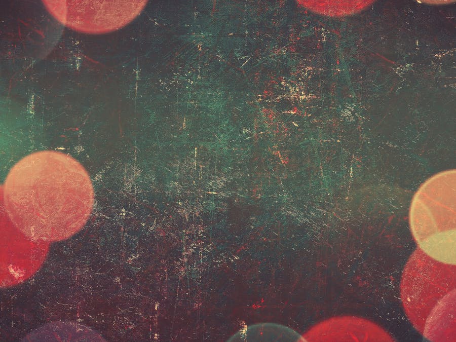 Abstract vintage grunge texture with vibrant bokeh circles, perfect for backgrounds and designs.