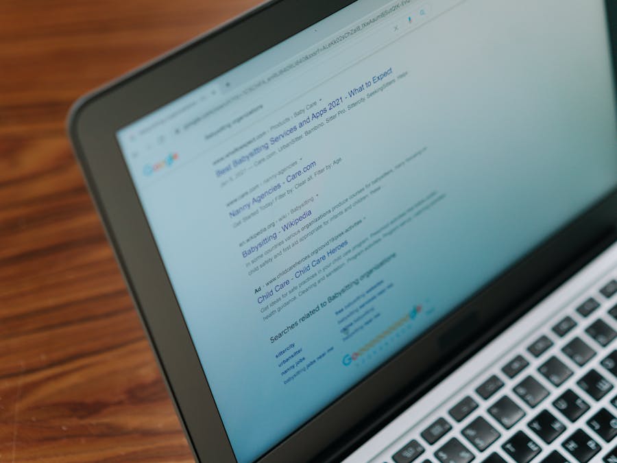 A close-up view of a laptop displaying a search engine page.