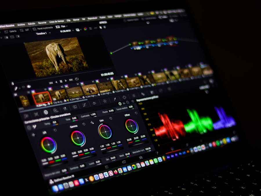 Close-up view of professional video editing software displaying colorful waveforms.