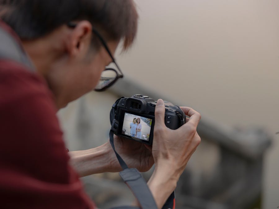 Photographer capturing outdoor moments with a digital camera.