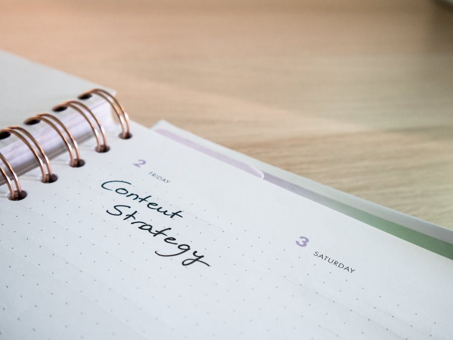 Close-up of a notebook page with 'Content Strategy' written on it, ideal for business planning visuals.