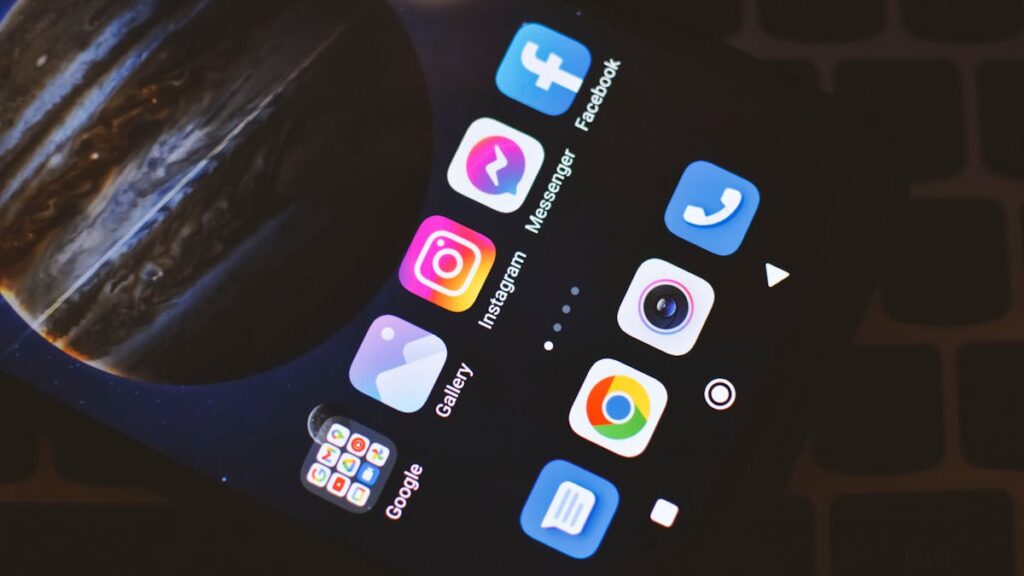 Smartphone screen showing popular social media and app icons including Facebook and Instagram.
