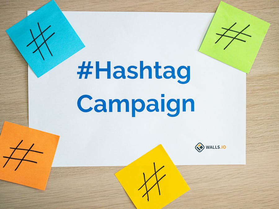 Colorful sticky notes arranged around a hashtag campaign sign, ideal for social media marketing concepts.