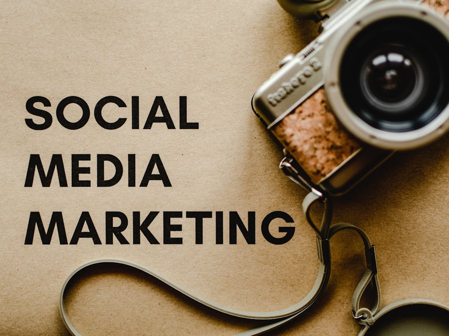 A vintage camera on brown paper with 'SOCIAL MEDIA MARKETING' text, perfect for marketing visuals.