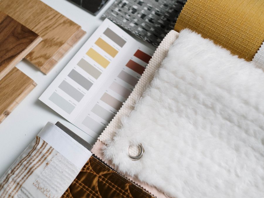 A flat lay of color swatches and fabric samples ideal for interior design inspiration.