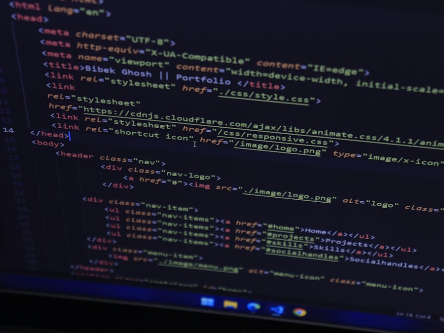 High-resolution close-up of HTML code displayed on a computer screen, perfect for technology themes.