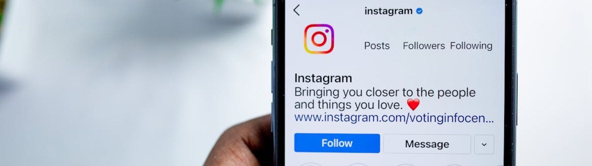 Close-up of a smartphone displaying the Instagram app, emphasizing social media connection.