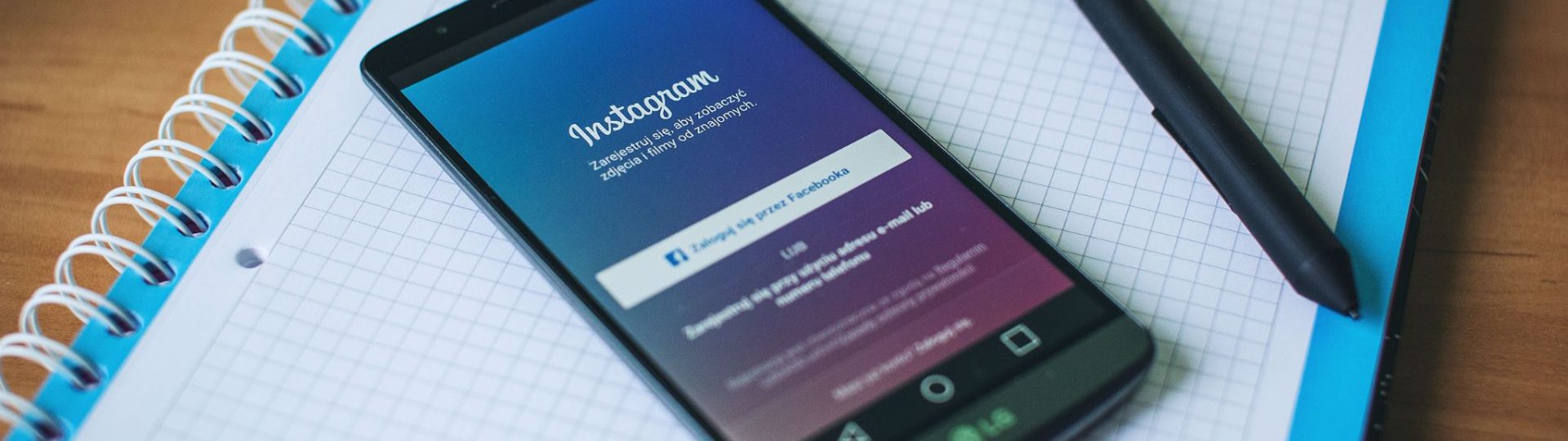 Smartphone with Instagram open on a student notebook
