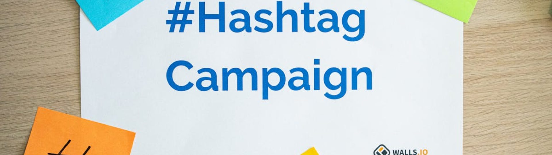Colorful sticky notes arranged around a hashtag campaign sign, ideal for social media marketing concepts.