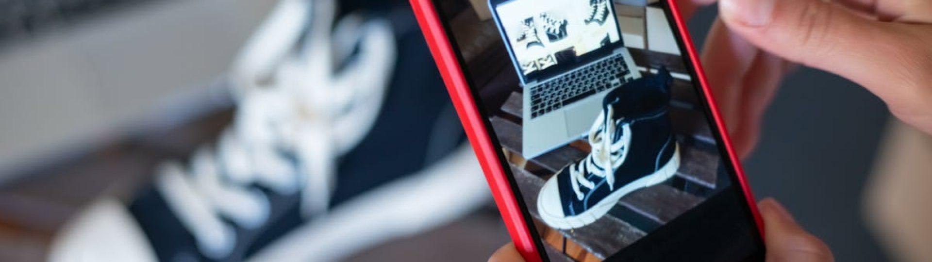 Capturing sneakers with a mobile phone for an online store showcase. E-commerce at its best.