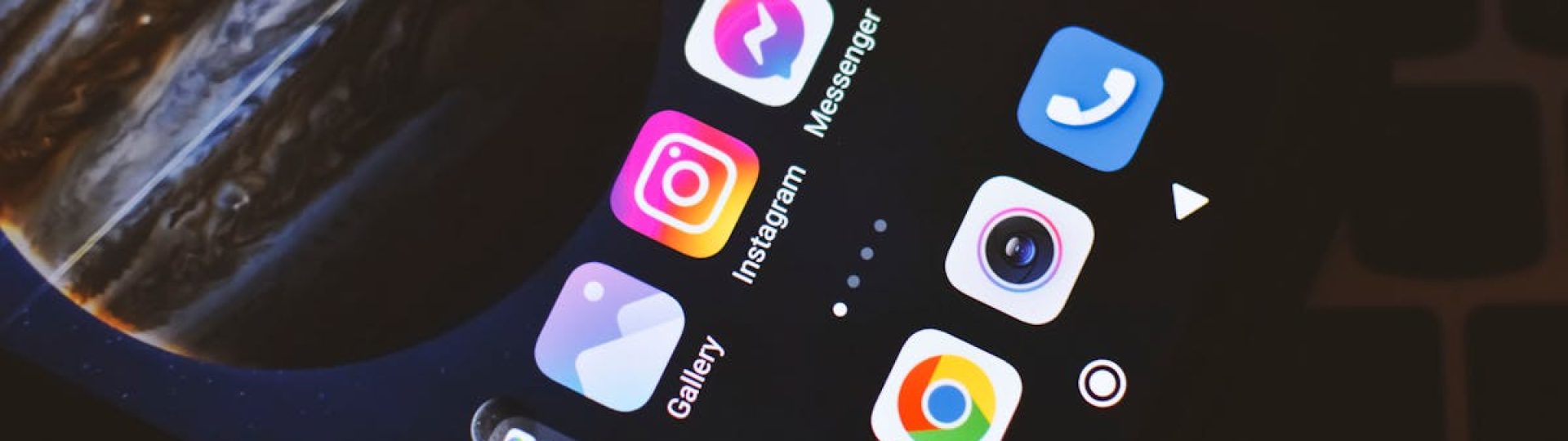 Smartphone screen showing popular social media and app icons including Facebook and Instagram.